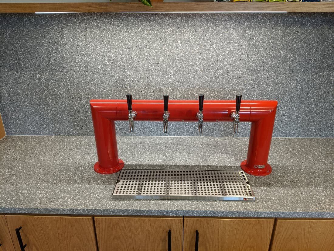 A kegerator with four taps