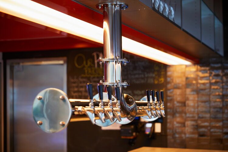 Row of draft beer keg taps