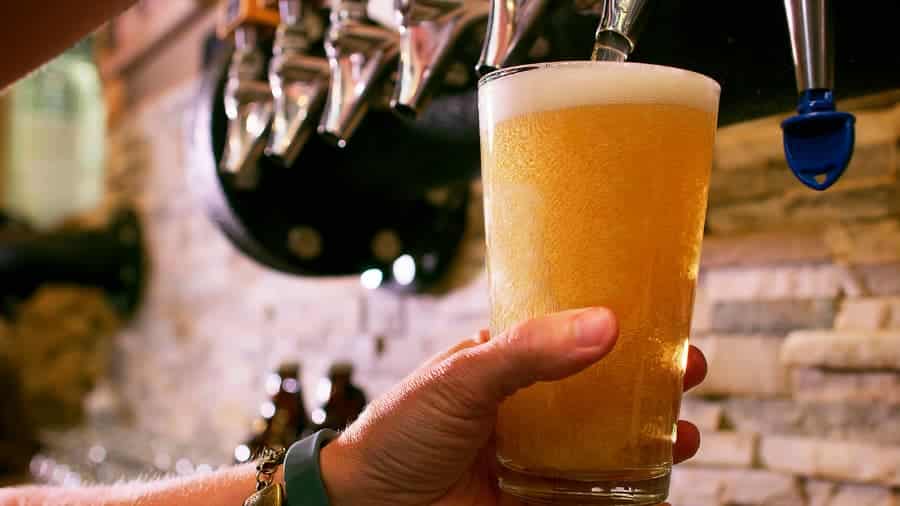 Bartender pouring a draft beer